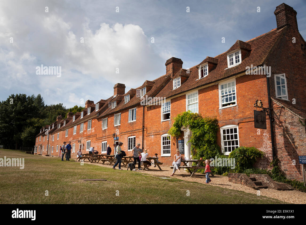 Customers outside the traditional cottages used as pub at the Master
