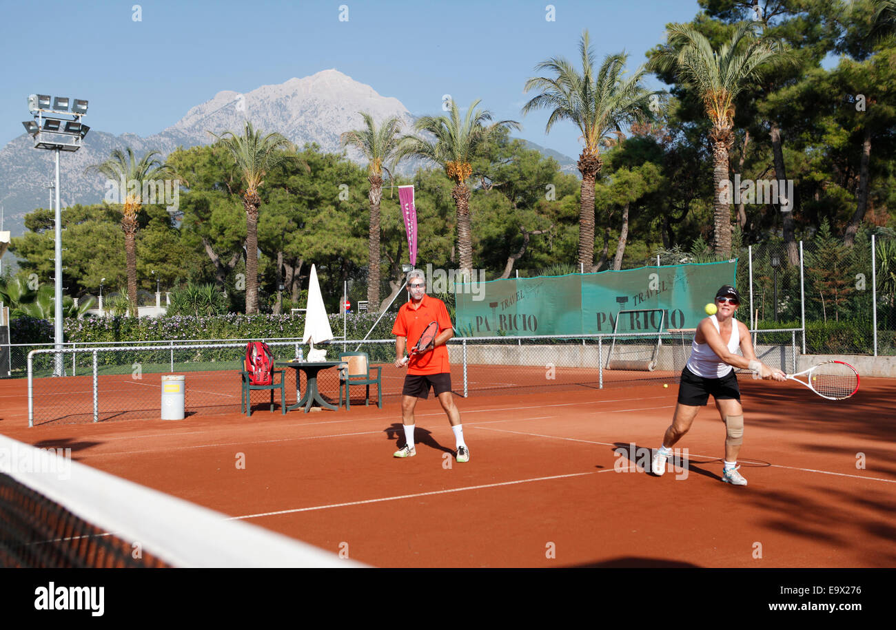 Couple playing tennis in the Gueral Premier Resort  in Tekirova,Antalya,Tuerkei, Stock Photo