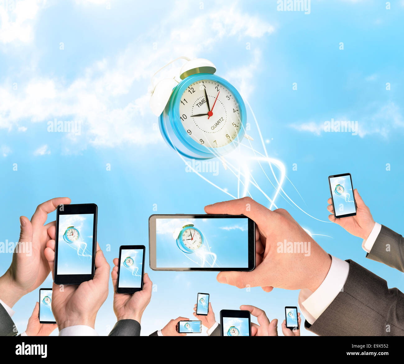Hands holding smart phones and shoot video as falling alarm clock Stock Photo Alamy