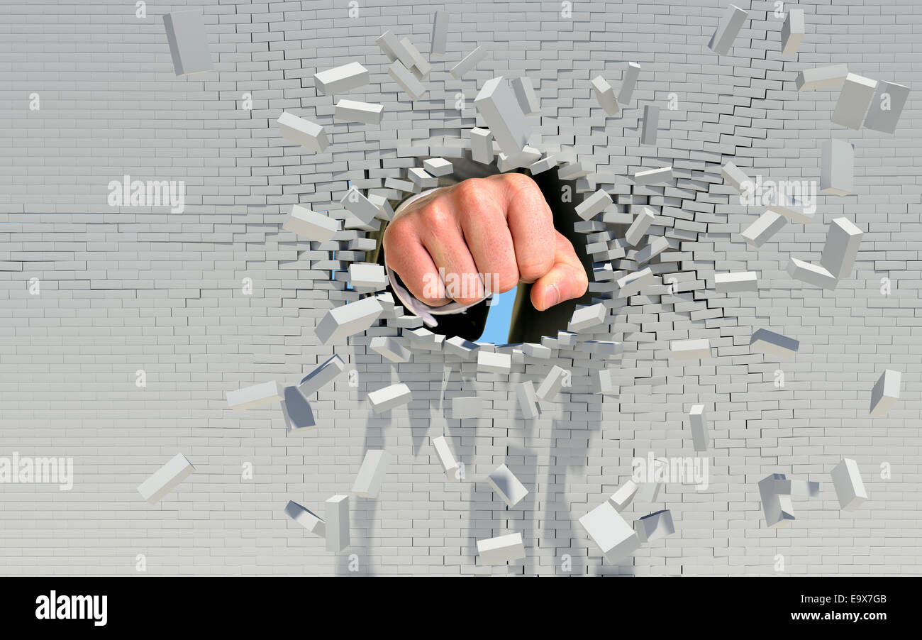 Fist punching through brick wall Stock Photo Alamy