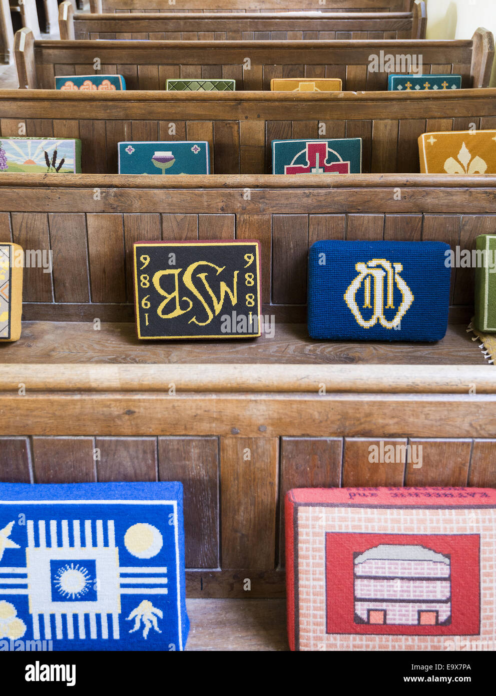 Decorative cushions line the wooden benches of St Mary's Church in