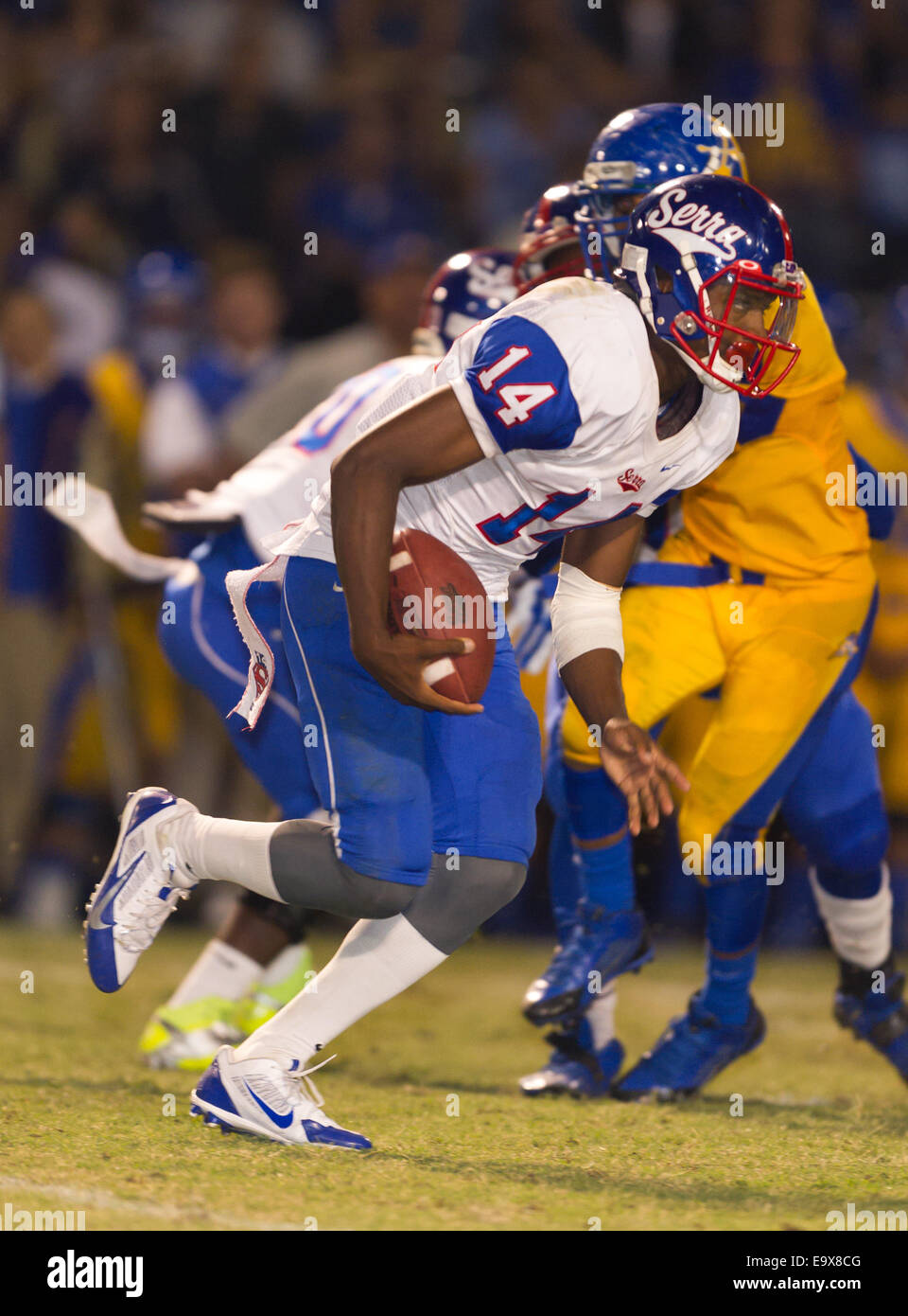October 4, 2014, La Puente, CA.Gardena Serra cavaliers quarterback (14) Khalil Tate in action during the Bishop Amat upset of the Cavaliers at Bishop Amat high school on October 3, 2014. The Cavaliers who are usually a nationally ranked high school football team, were upset by Bishop Amat 14 - 7. (Mandatory Credit: Ed Ruvalcaba/MarinMedia.org) (Complete photographer, and company credit required) Stock Photo