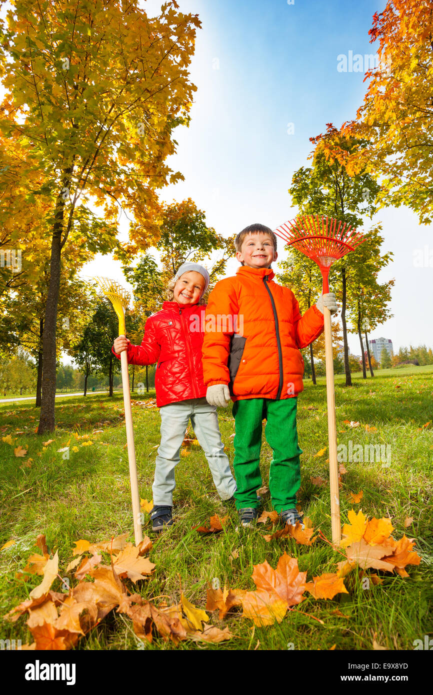 Boy and girl rake autumn leaves hi-res stock photography and images - Alamy