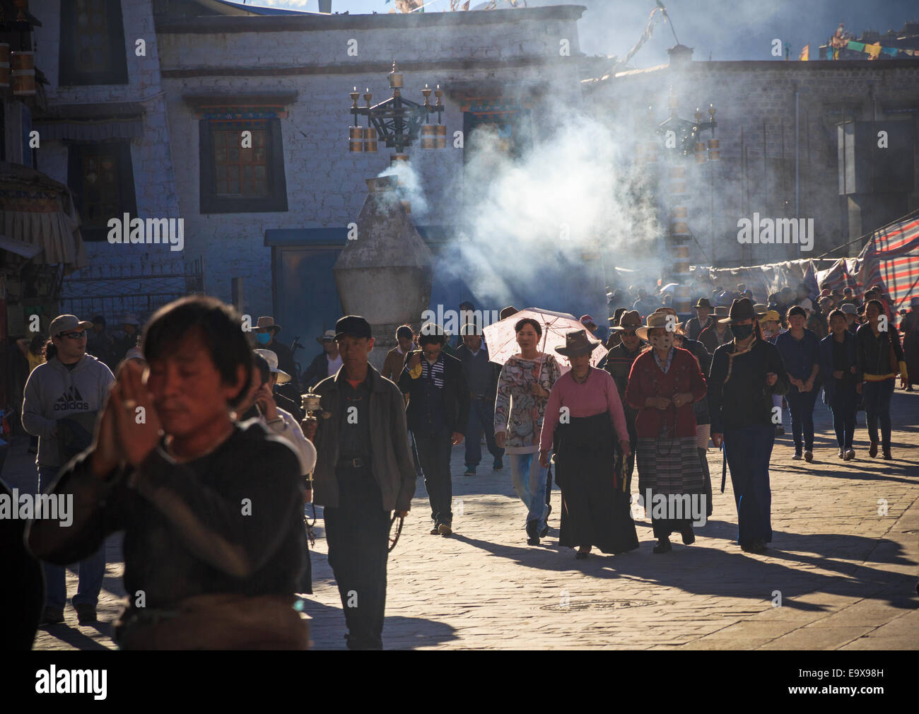 [Editorial Use Only] LHASA, TIBET - Tibetans walking the Barkhor, a pilgrimage kora around Tibet's most holy temple, the Jokhang Stock Photo