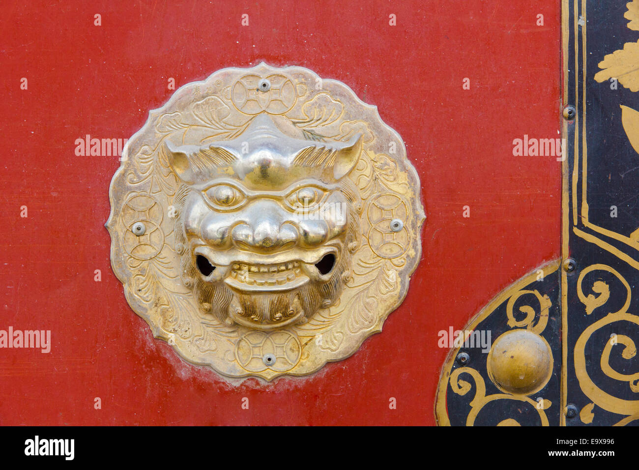Detail of red Chinese door with dragon head Stock Photo