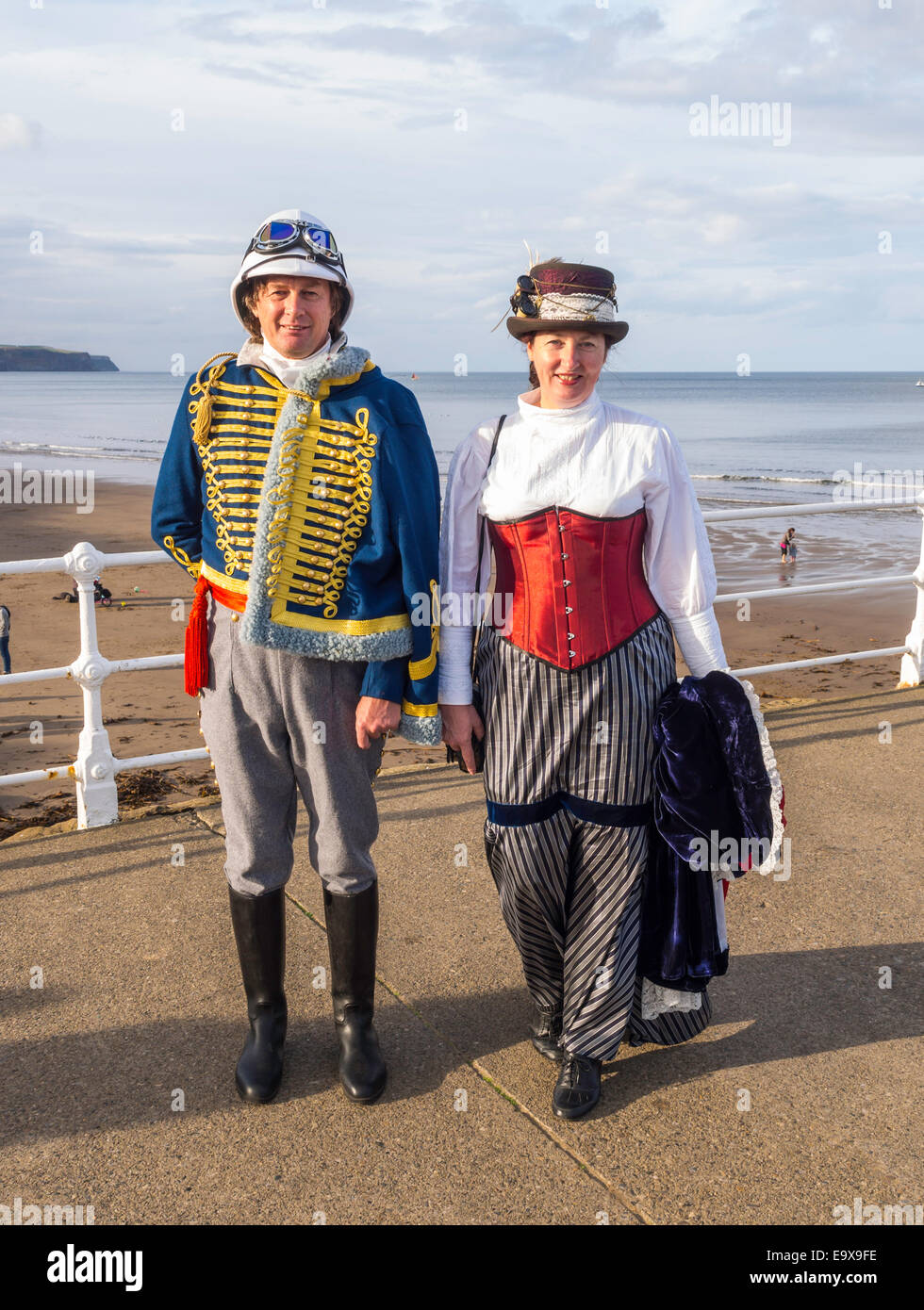 A man and woman in pseudo Military Dress on the pier at the Whitby Goth Week End Autumn 2014 Stock Photo