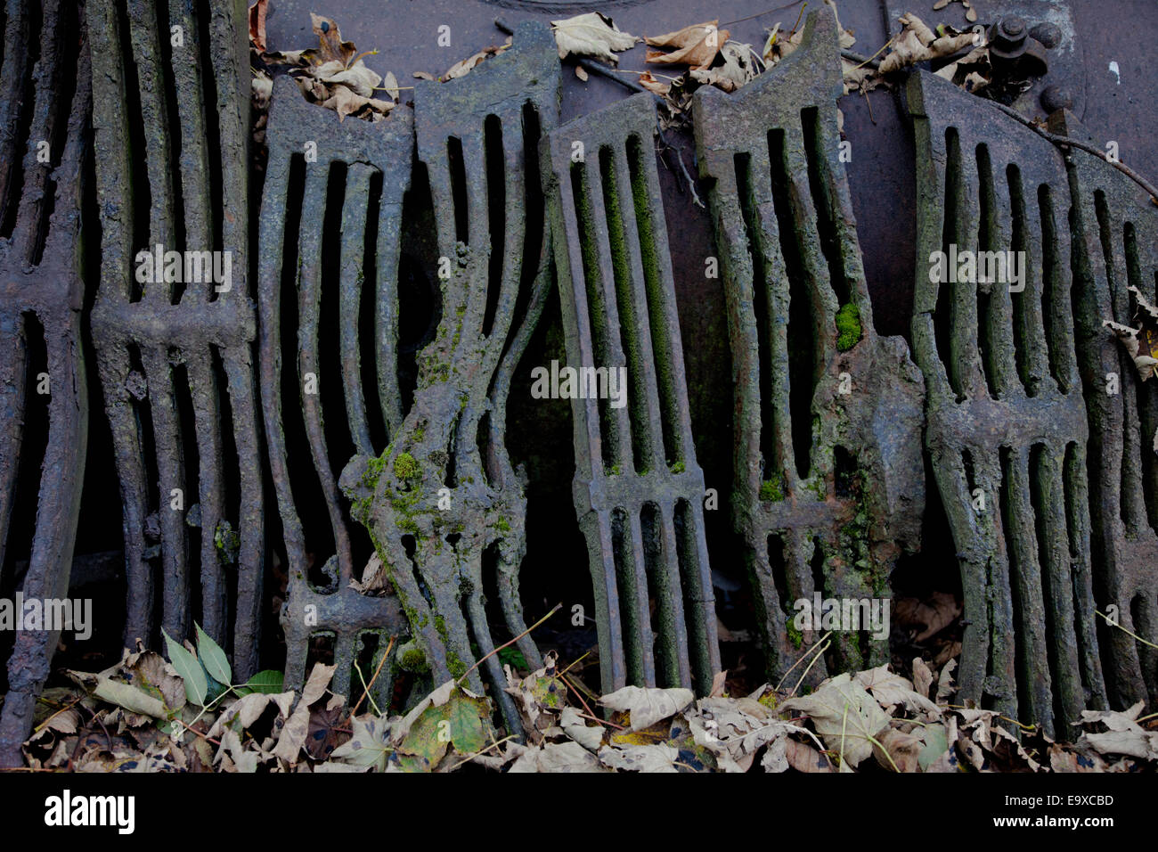 Old cast iron fire grates standing upright Stock Photo - Alamy