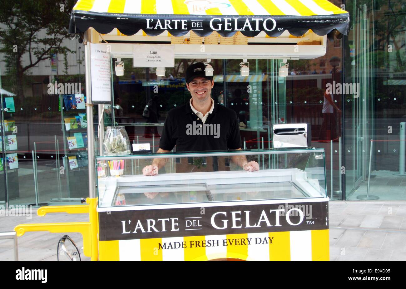 NYC:  Smiling vendor at the L'Arte del Gelato ice cream cart in front of Lincoln Center's Alice Tully Hall Stock Photo