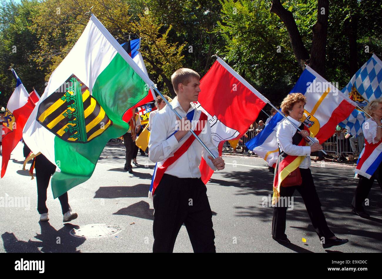 NYC Marchers carrying colourful flags of German states at the annual