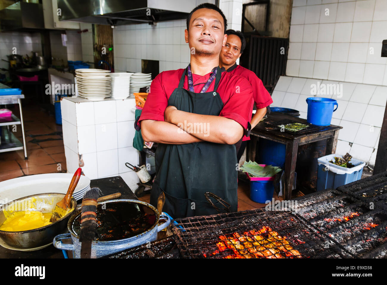 Cook barbecuing shrimp at Candi Gama Restaurant, Semarang, Central Java, Indonesia Stock Photo