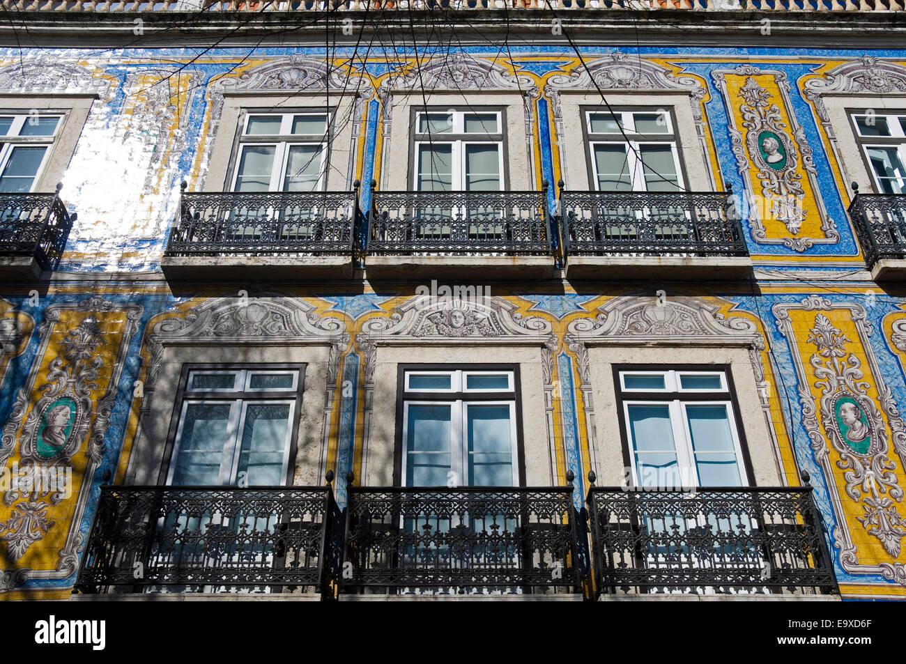 Horizontal close up of the decorative tiles covering a house in Lisbon. Stock Photo