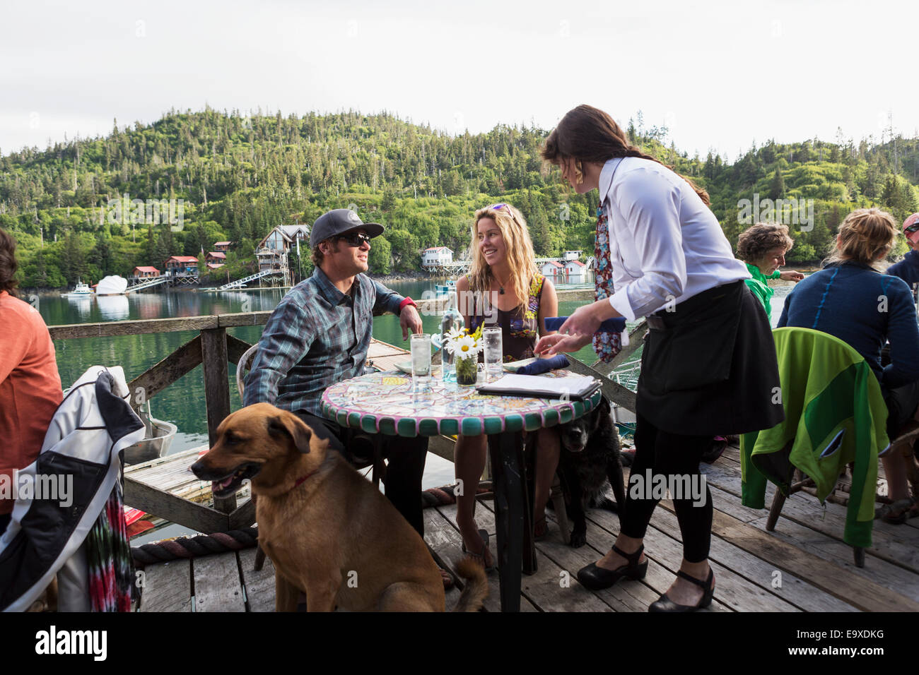 A couple in their 30's dining at the Saltry Restaurant in Halibut Cove