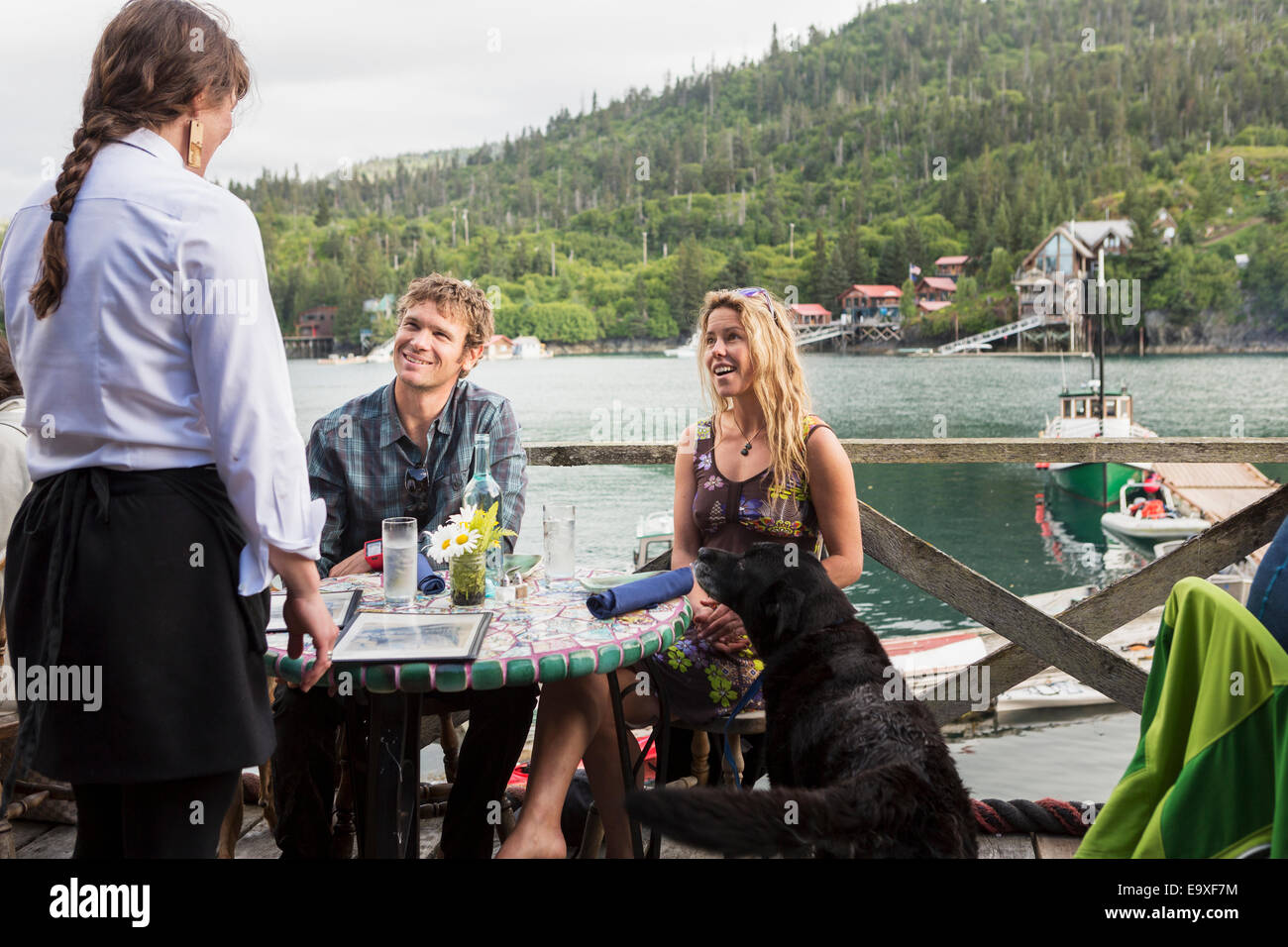 A couple in their 30's dining at the Saltry Restaurant in Halibut Cove