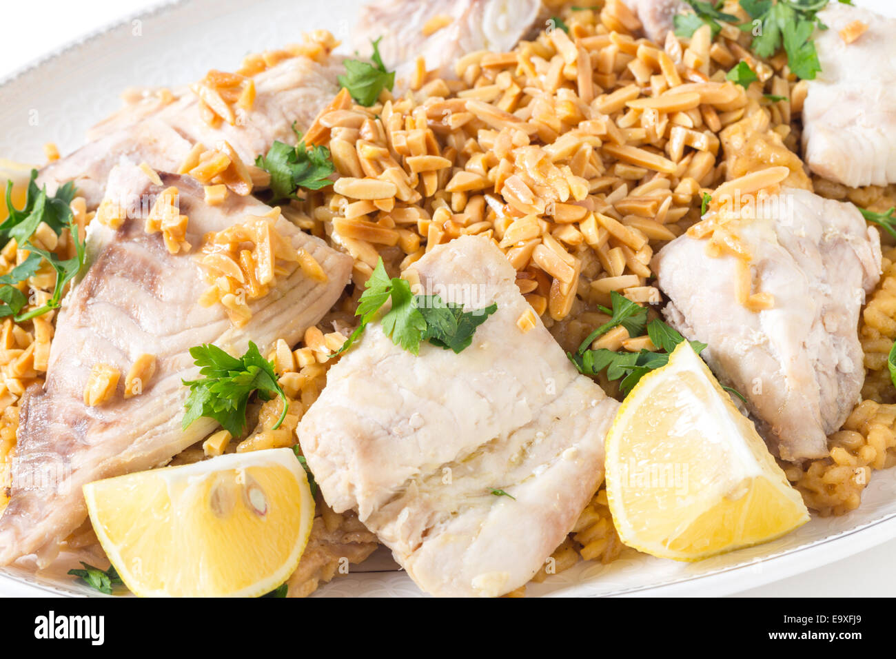 Lebanesesstyle fried fish served with caramelised onion flavoured rice