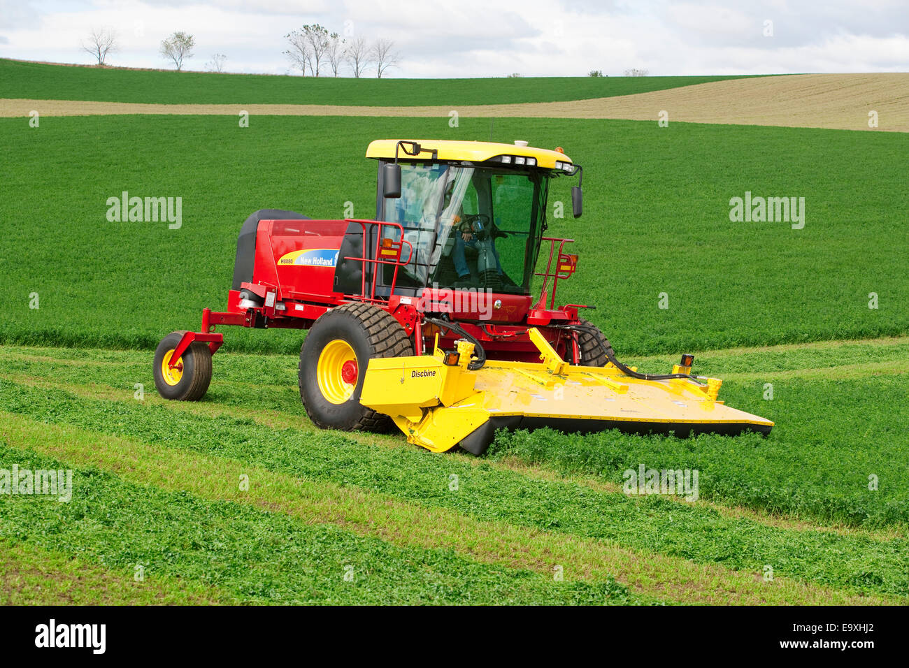 Agriculture A self propelled New Holland Discmower silage harvester