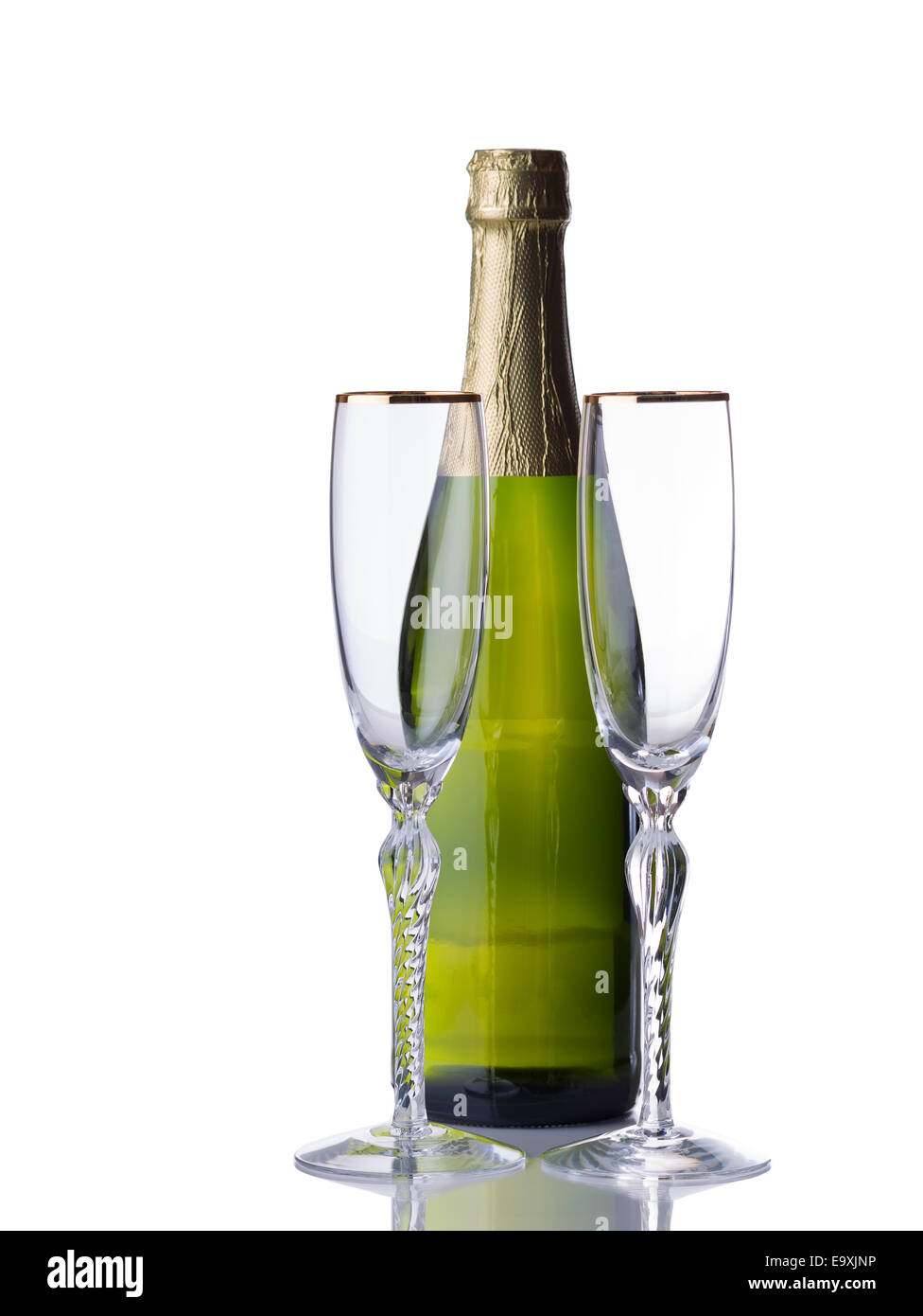 Empty tall elegant drinking glasses with unopened bottle of sparkling