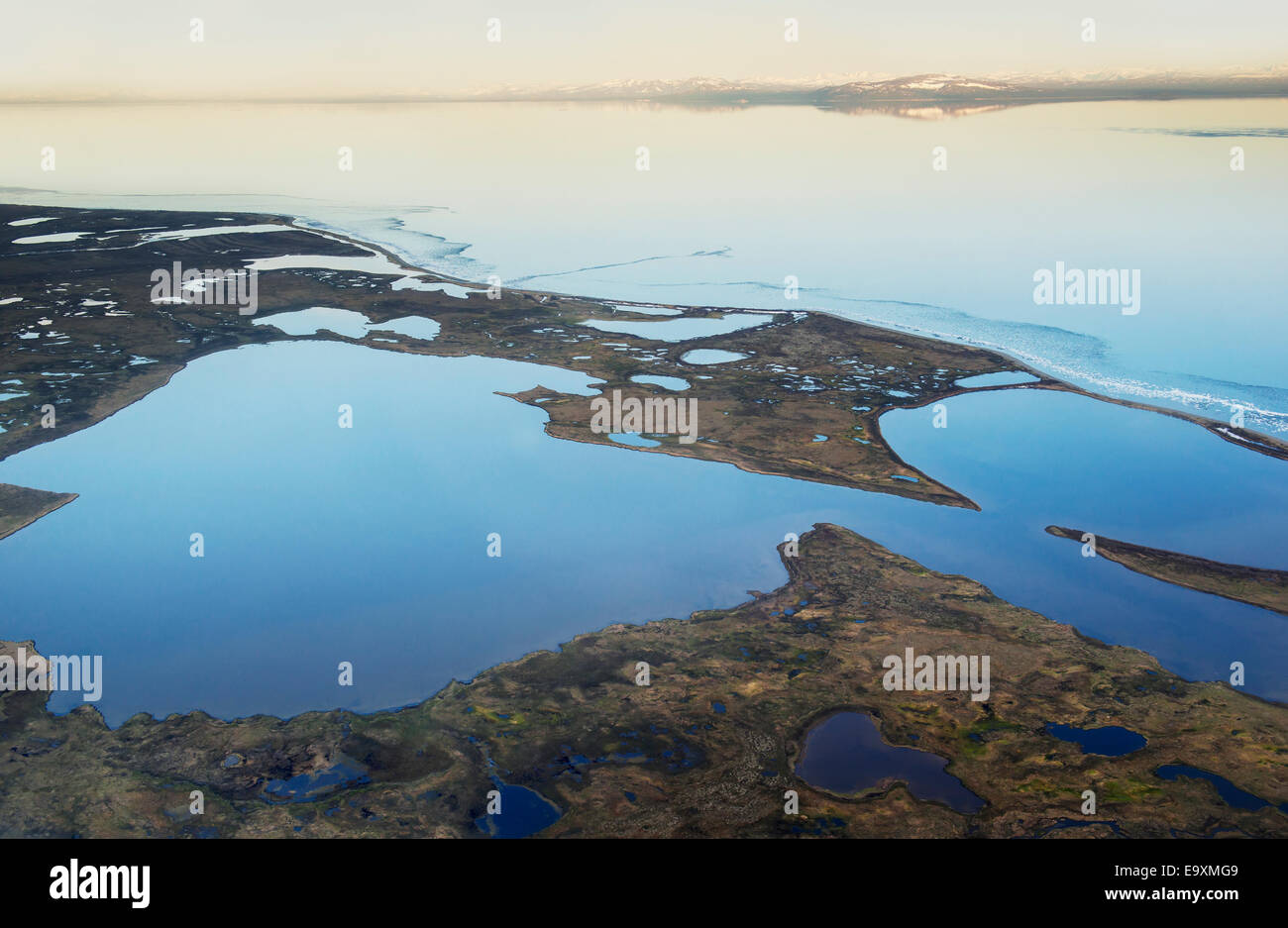 Aerial view of Lake Iliamna and scattered ponds in early summer, Southwestern Alaska Stock Photo