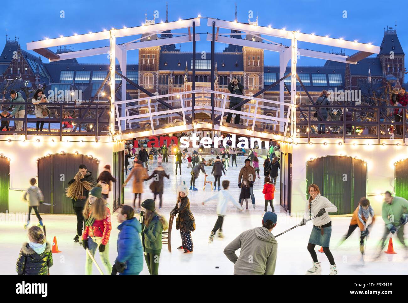 Amsterdam skating on the ice rink in front of the Rijksmuseum Rijks Museum. Logo I Amsterdam visible behind a model drawbridge. Stock Photo