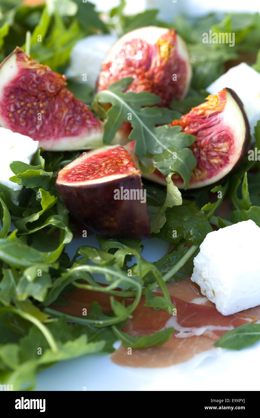 Fig salad with rucola, goat cheese and Parma ham Stock Photo Alamy
