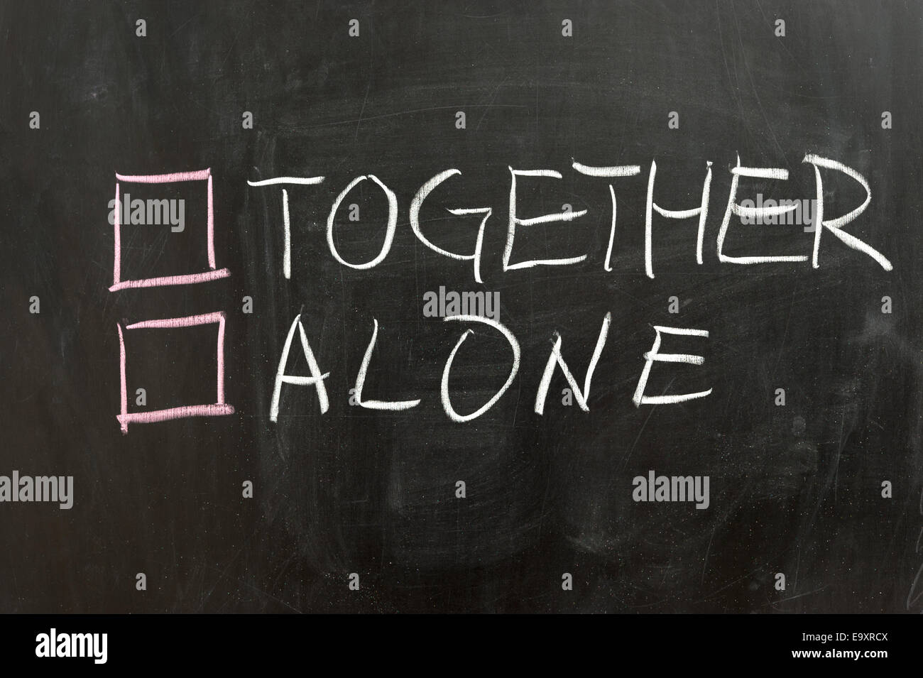Together or alone options on the chalkboard Stock Photo