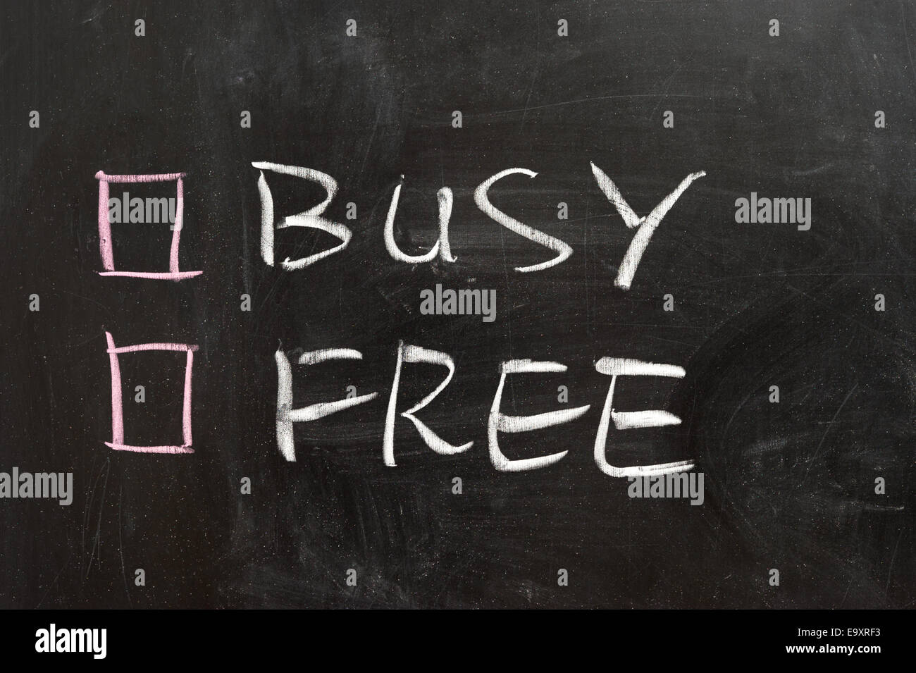 Busy or free options on the chalkboard Stock Photo