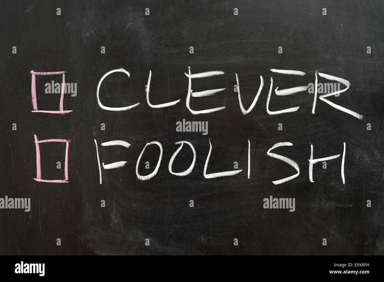 Clever or foolish options on the chalkboard Stock Photo