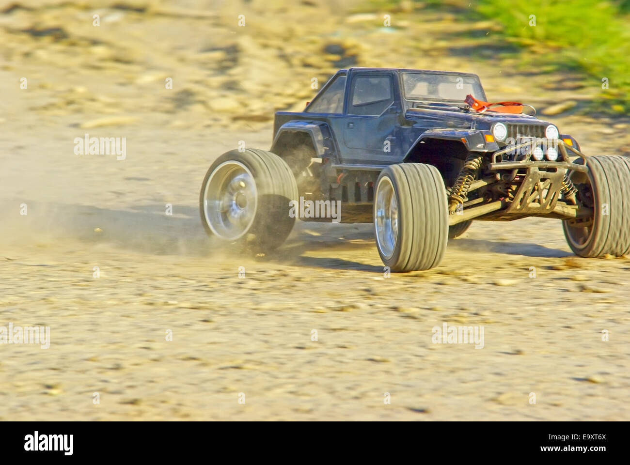 Speeding radio controlled car on the ground Stock Photo Alamy