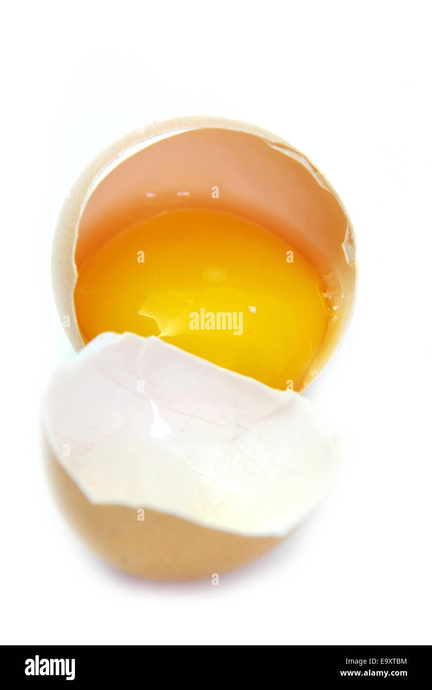 Close up image of a broken egg on white Stock Photo