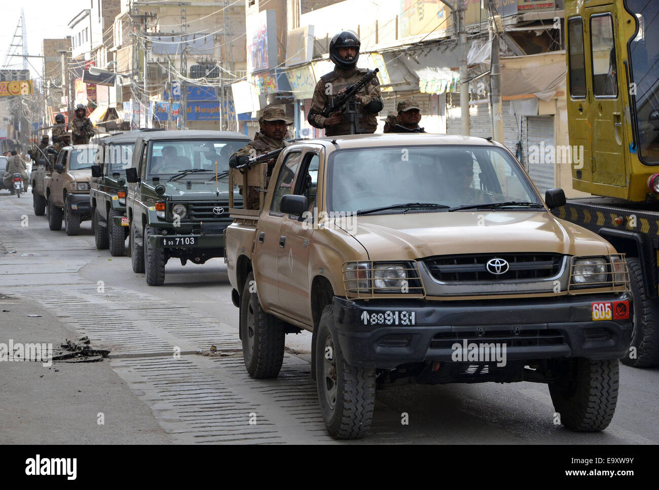 Quetta. 4th Nov, 2014. Pakistani policemen patrol on the road ahead of Ashura procession on the tenth day of Islamic holy month of Muharram in southwest Pakistan's Quetta, Nov. 4, 2014. Pakistani authorities stepped up security across the country for the sensitive Ashura days of the holy month of Muharram. © Asad/Xinhua/Alamy Live News Stock Photo