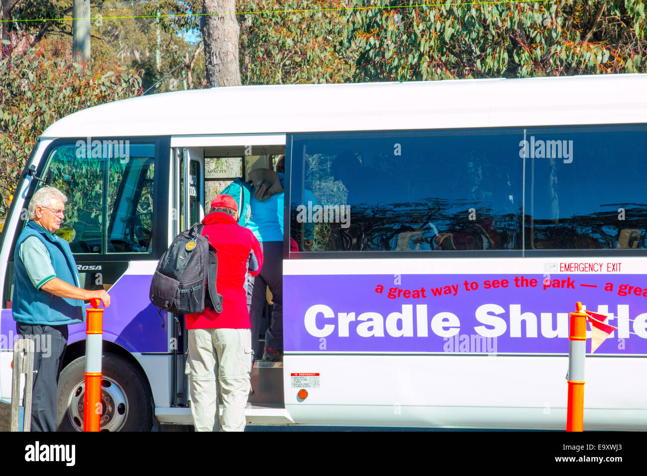 walkers boarding a bus at cradle mountain visitor centre to be taken to
