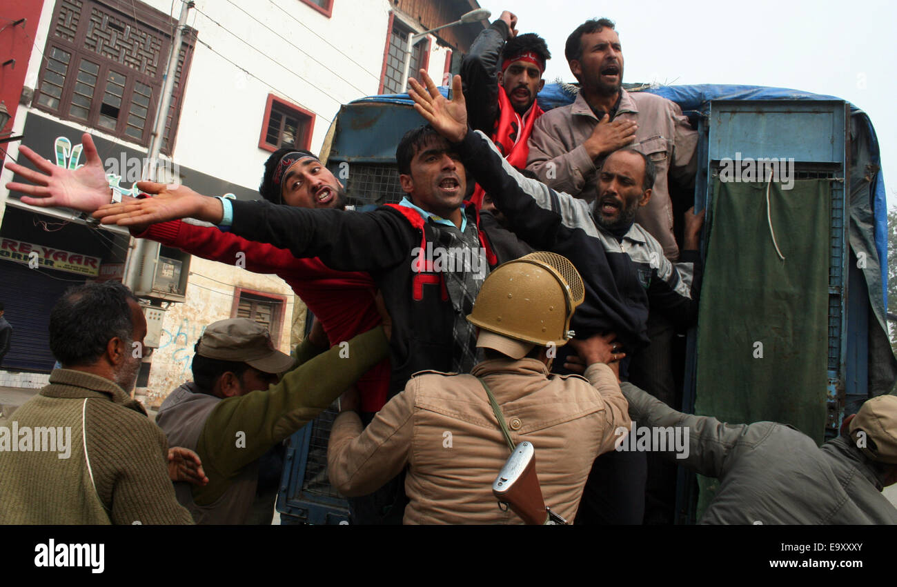 Srinagar, Indian Administered Kashmir: 04 November Kashmiri Shiite mourner  is pulled by the police during strict restrictions imposed by authorities  to thwart any mourning commemorations by Kashmiri Shiite Muslims on10 th  Muharram,