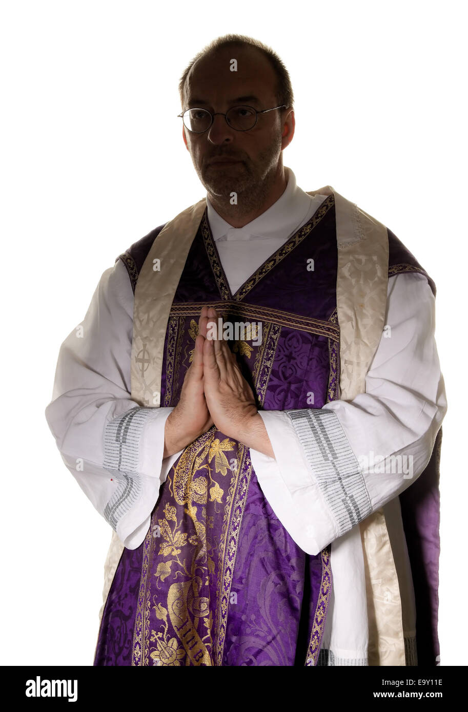 A Catholic Priest In Prayer In Worship Stock Photo Alamy