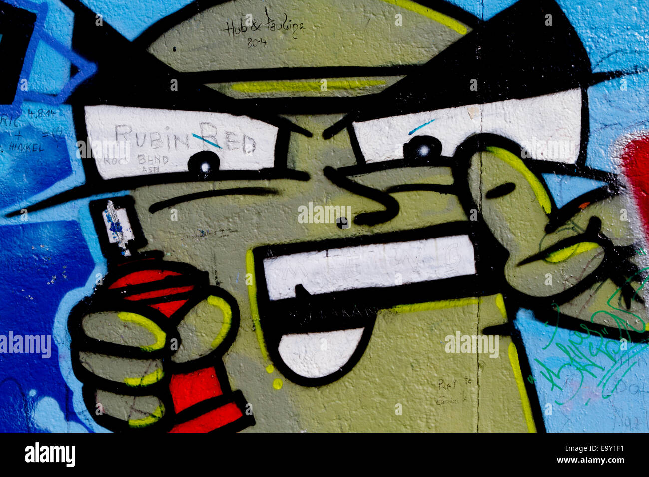 Berlin wall graffiti cartoon character spray can Stock Photo