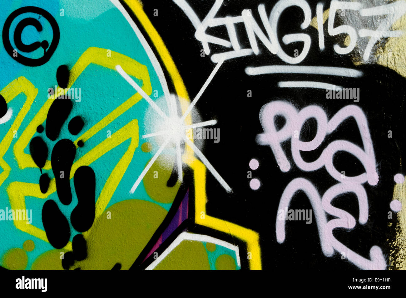 colourful Berlin wall graffiti pea king footprints Stock Photo