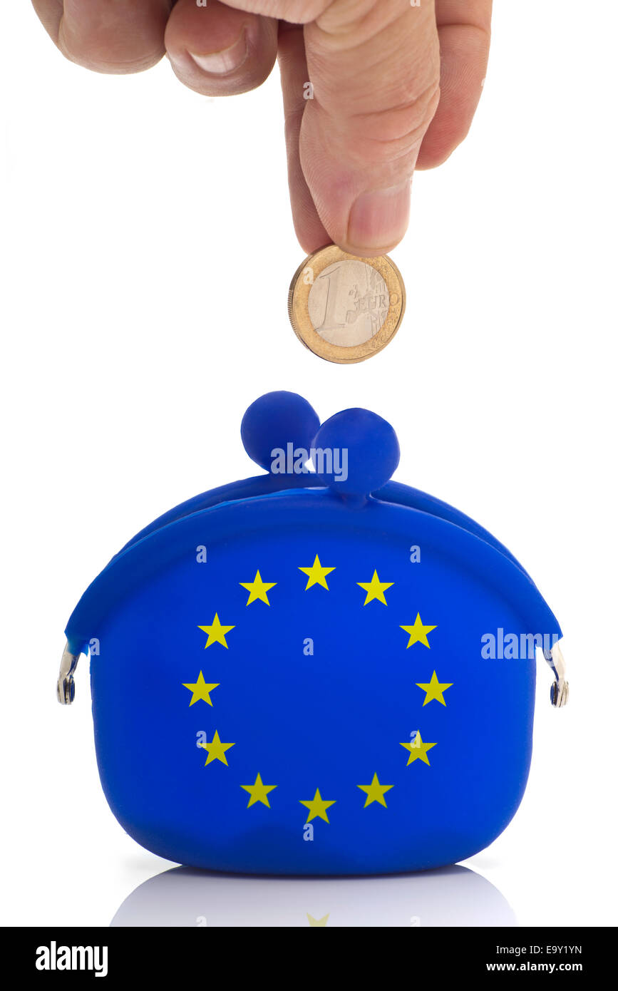 Hand dropping a euro coin in a blue purse with euro-stars Stock Photo