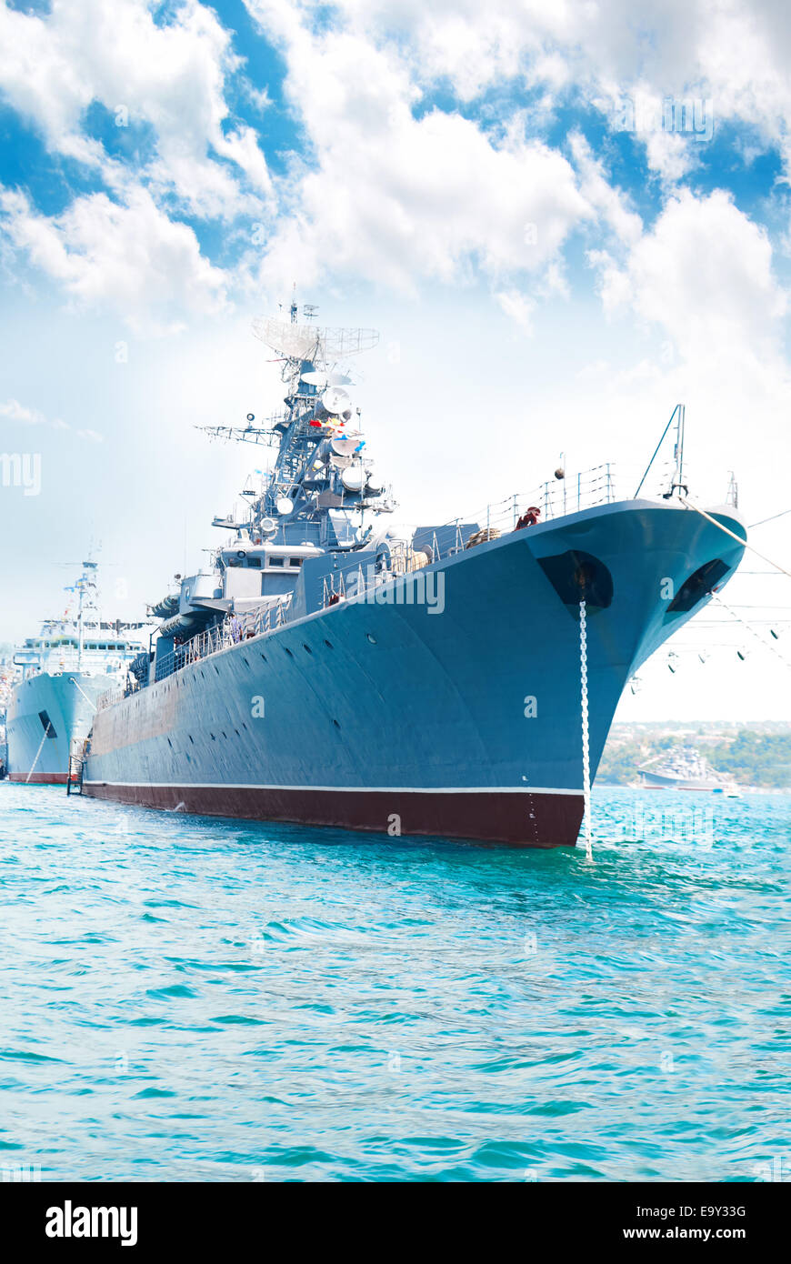 Military navy ship in the bay against blue sky Stock Photo - Alamy