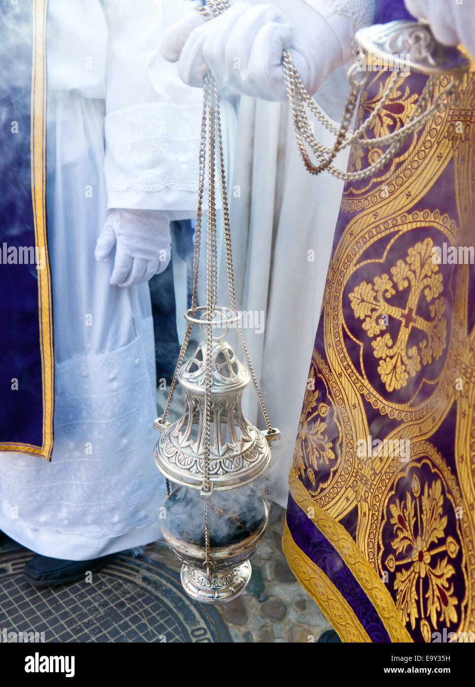 A jar full of incense in a religious procession. Stock Photo