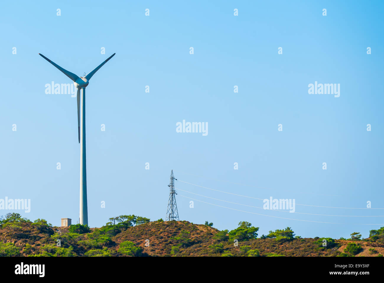 windmill and power line on the hill Stock Photo - Alamy