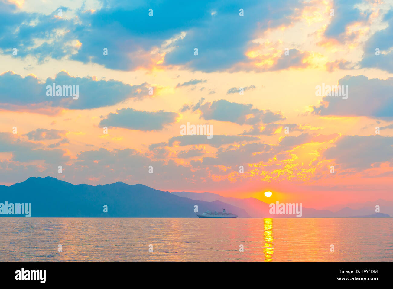 passenger ship on the sea and a beautiful sunrise Stock Photo - Alamy