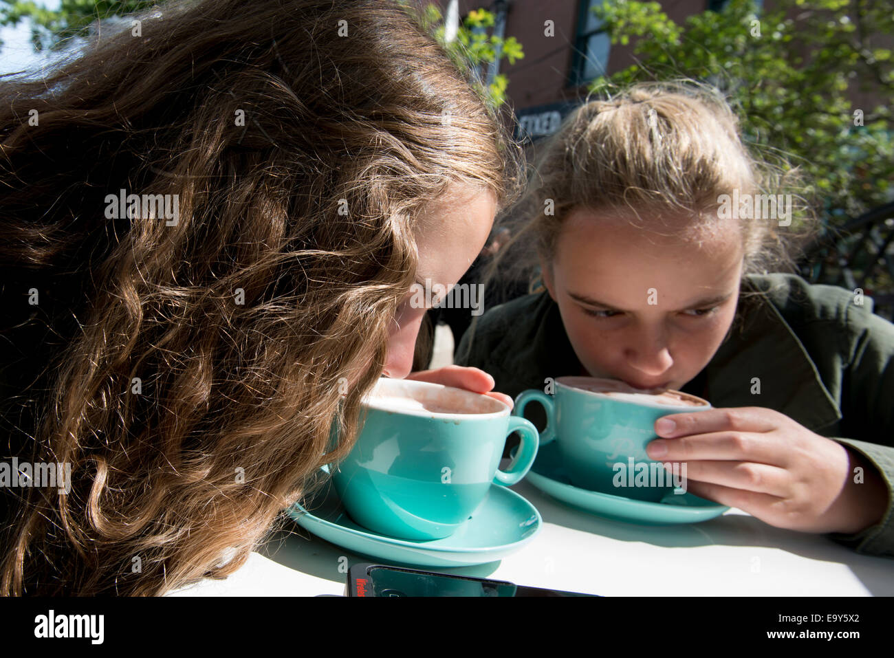Girls holding each other hi-res stock photography and images - Alamy