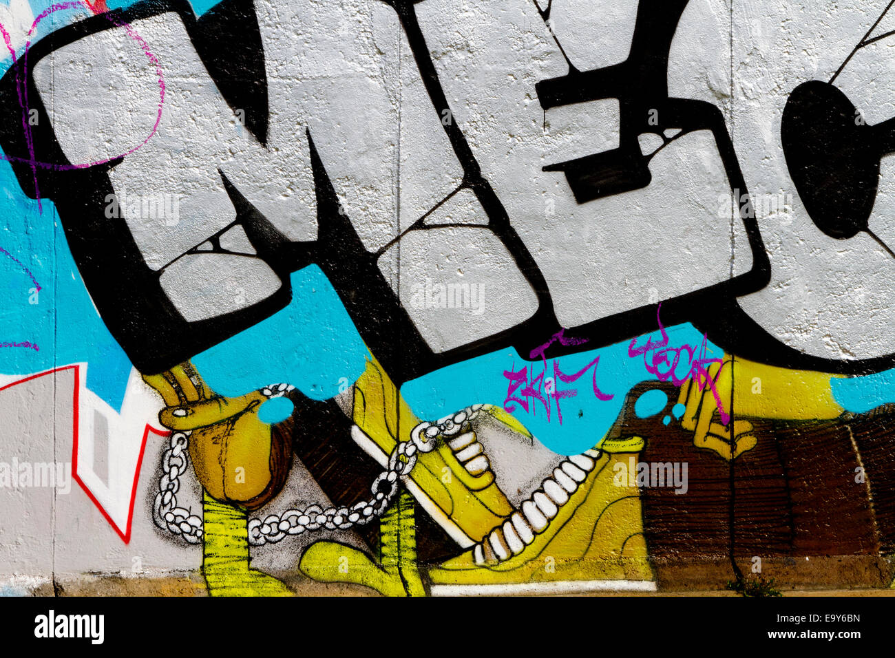 Graffiti Berlin wall art tag urban colour trainers Stock Photo