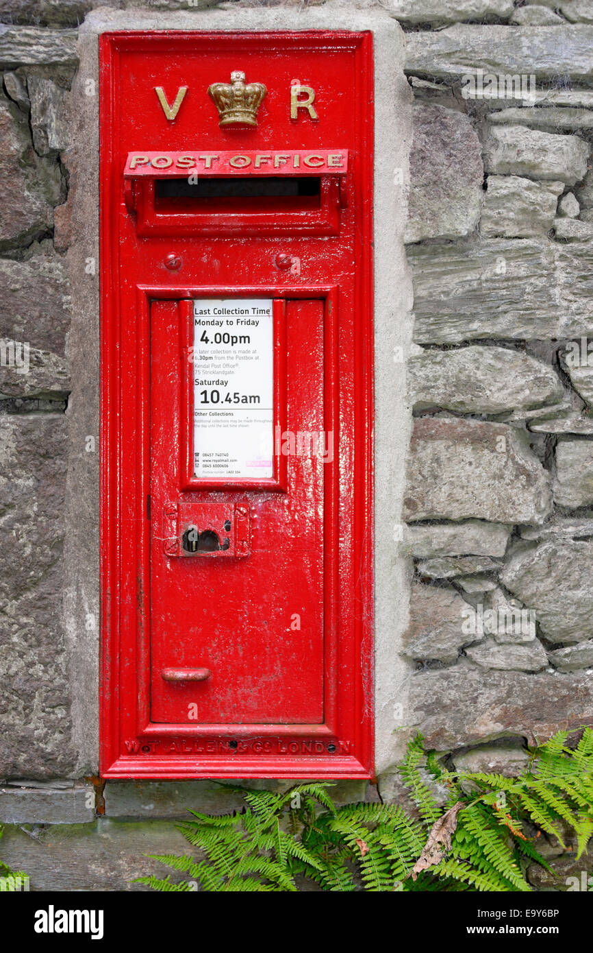 An attractive antique Victorian post box in a cottage wall near Grasmere, Lake District, Cumbria, England Stock Photo