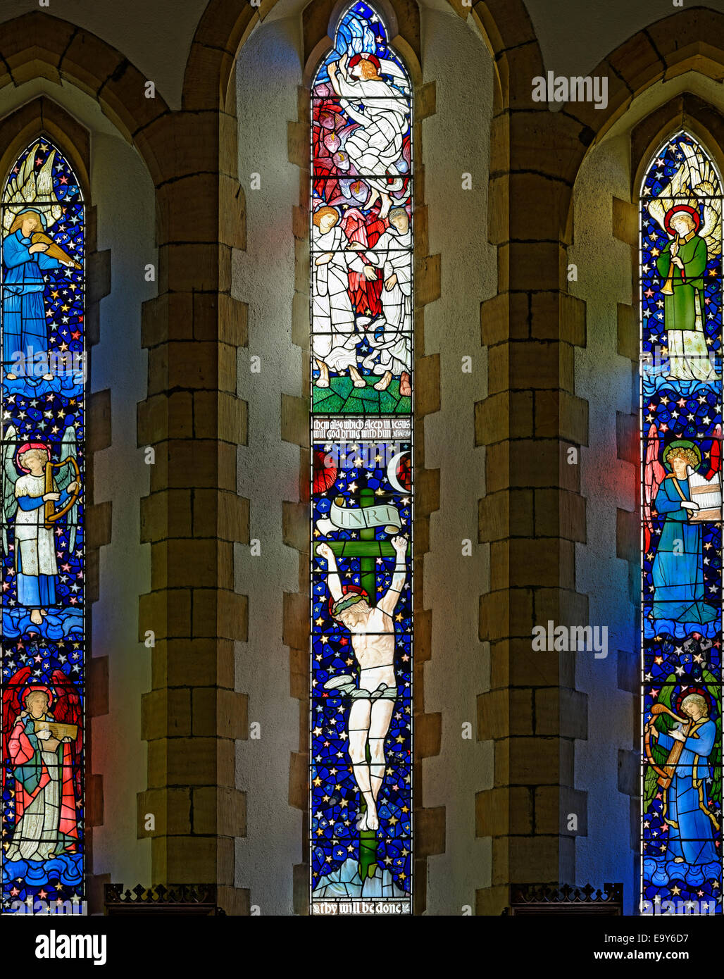 'Christ's crucifixion and ascent into heaven' by Edward Burne Jones and William Morris, Staveley Church, Lake District, England Stock Photo