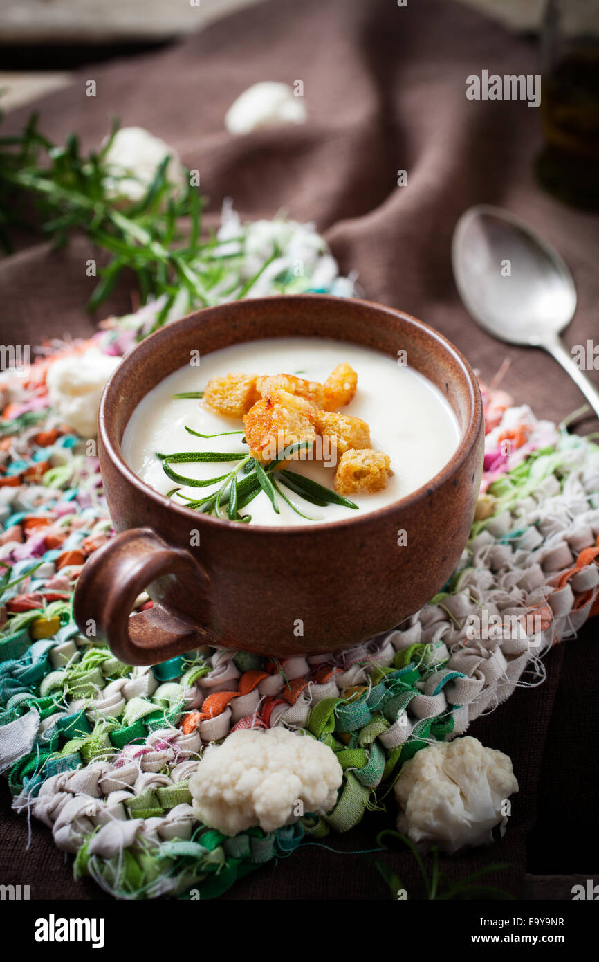 Creamy cauliflower soup with herbs and crutons Stock Photo
