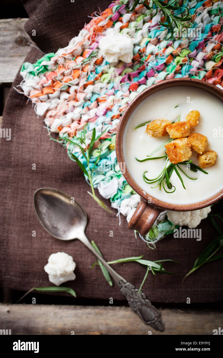 Creamy cauliflower soup with herbs and crutons Stock Photo