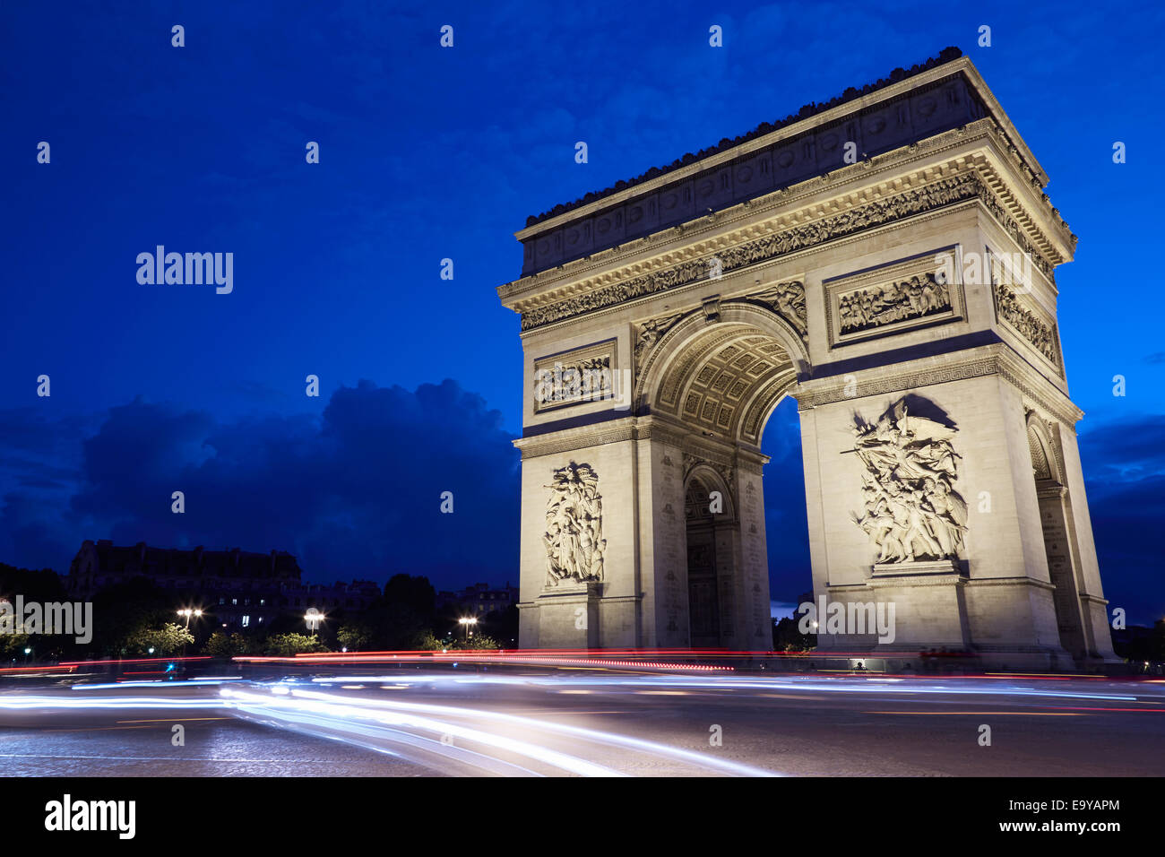 Arc de Triomphe in Paris at night, car passing lights Stock Photo