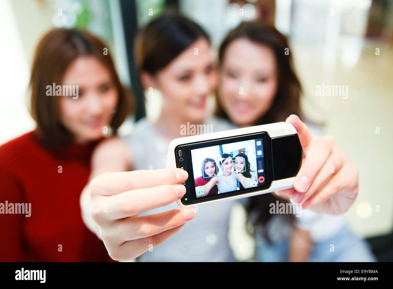 Young women taking photos Stock Photo