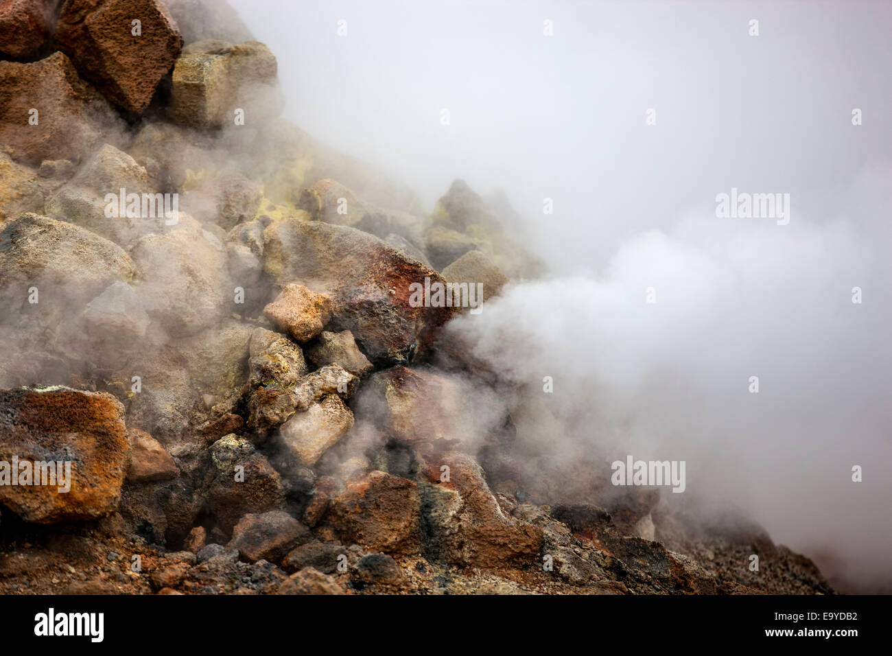 Fumarole evacuating pressurized gas from volcanic activity in the geothermal area of Hverir Iceland near Lake Myvatn. Stock Photo