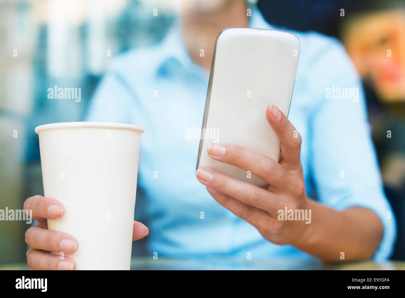 app business cafe candid casual caucasian cell city coffee computer connecting ebook email female internet lifestyle message Stock Photo