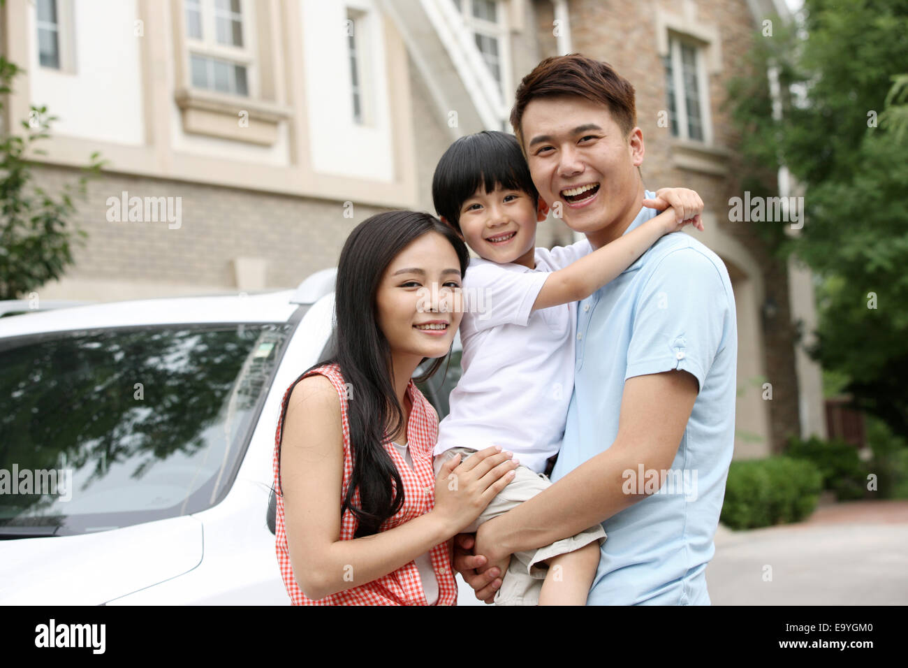 Boy with his parents Stock Photo - Alamy
